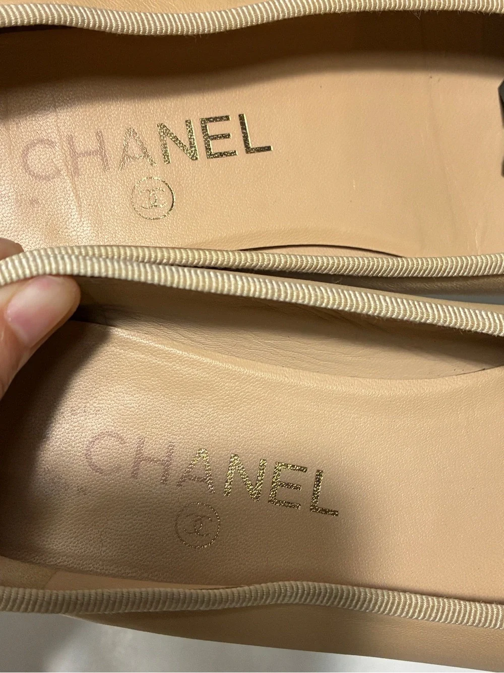 CHANEL Beige Leather Ballet Flats with Black Cap Toe and CC Logo